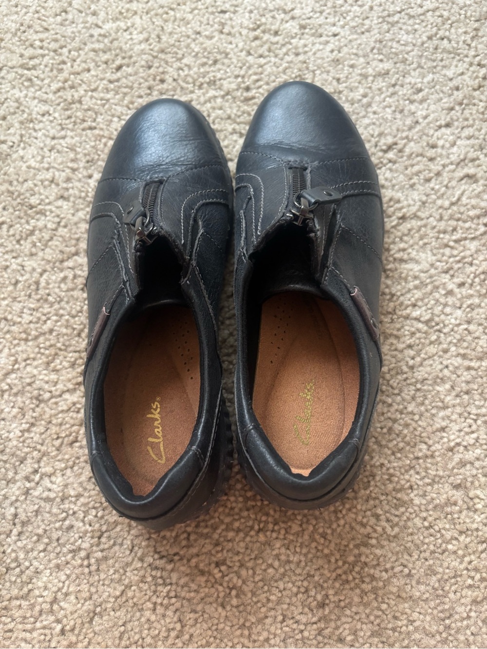 Clarks Women’s Black Leather Zip-Front Mules